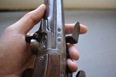 Lot 752 - A 25-BORE DOUBLE BARRELLED FLINTLOCK TURNOVER HOLSTER PISTOL BY WILSON