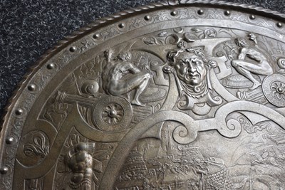 Lot 273 - A 19TH CENTURY BRONZED CAST PARADE SHIELD