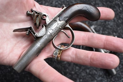 Lot 311 - A SCARCE CASED PAIR OF 77-BORE FLINTLOCK MUFF PISTOLS BY W. BOND