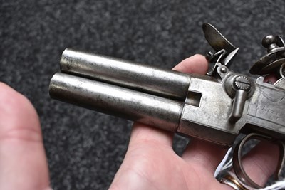 Lot 318 - A 54-BORE LARGE SIZED FLINTLOCK TAP ACTION OVERCOAT PISTOLBY KETLAND & CO